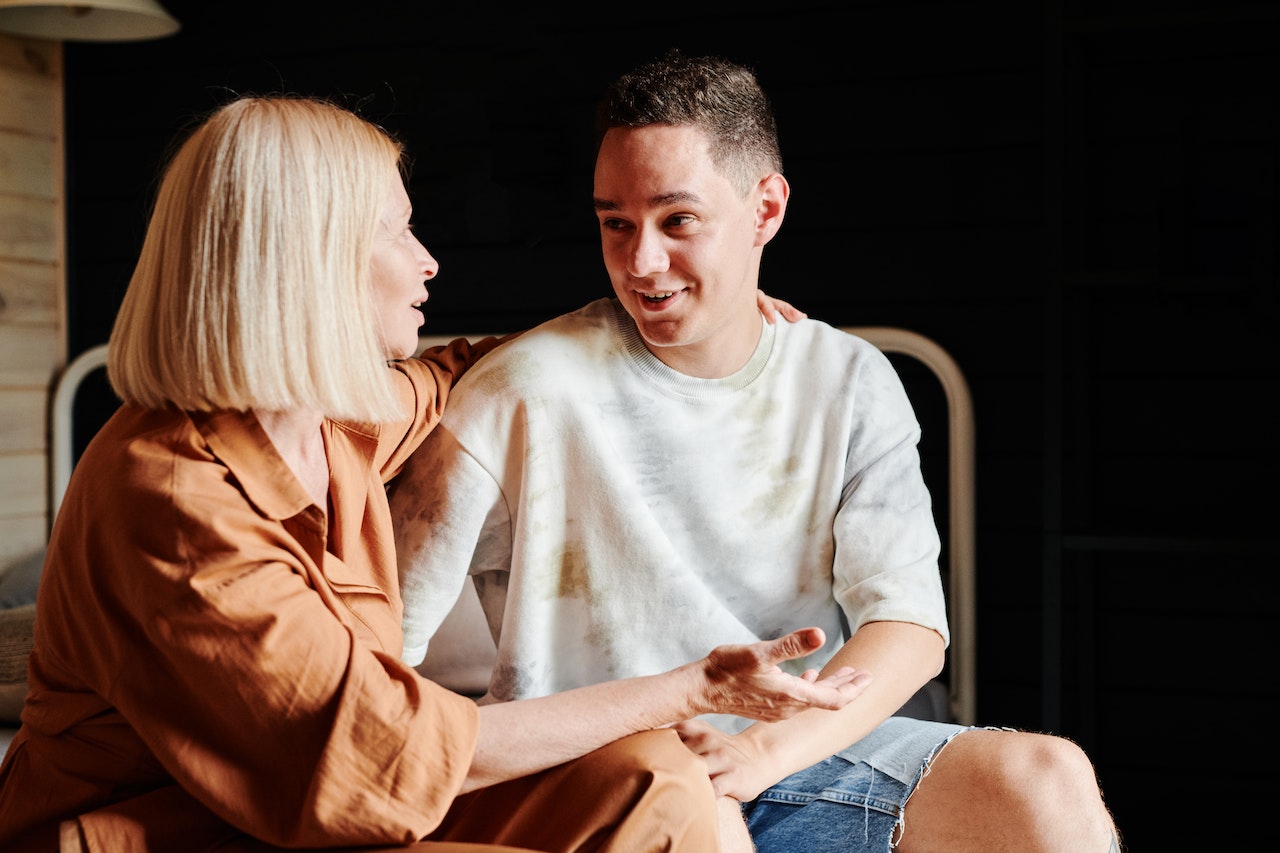 Photo of a mom and her teenage son smiling