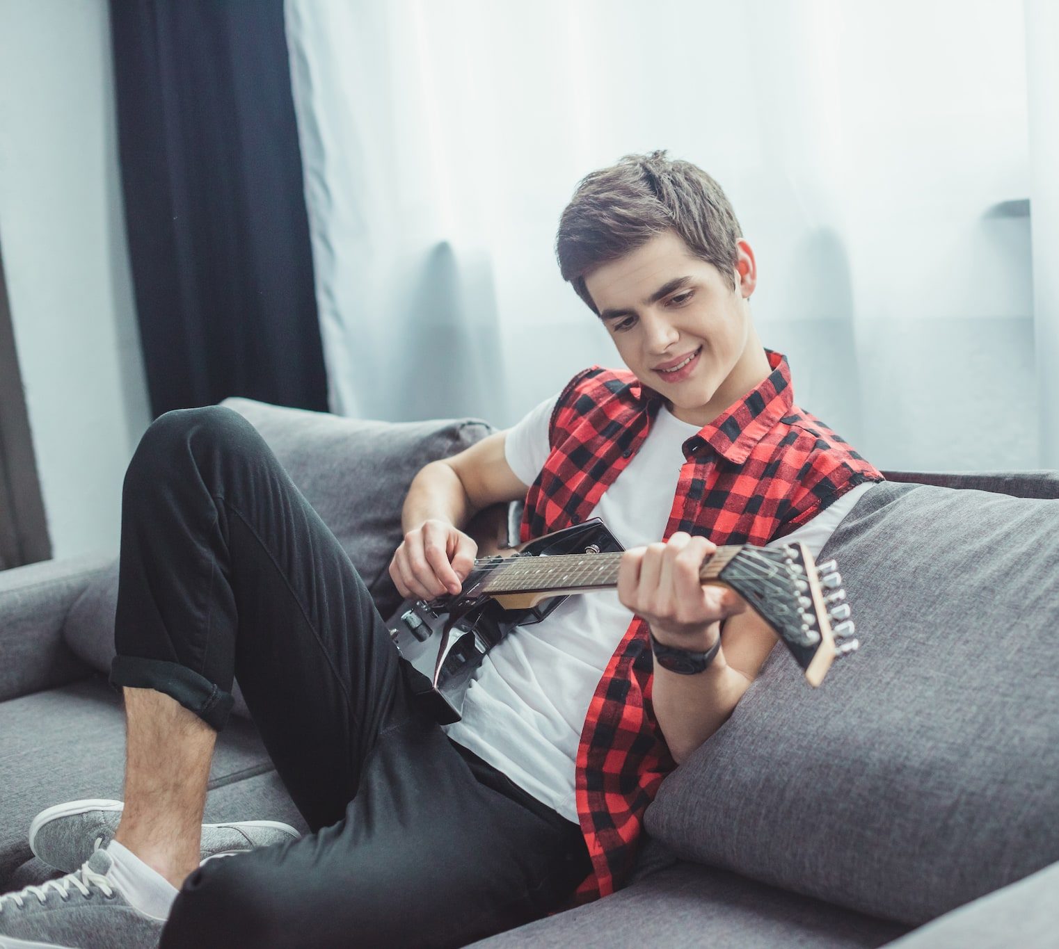 teen playing guitar